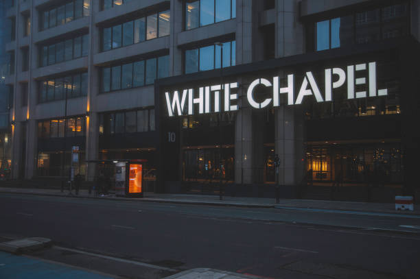 Newly installed signage lighting on a commercial building facade